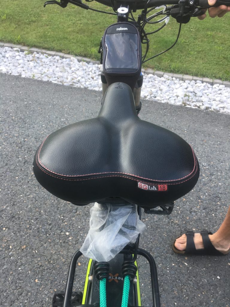 Saddle behind